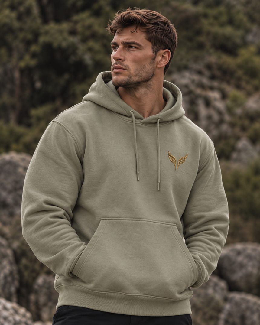 A man in a eucalyptus hooded sweatshirt with the gold wings on the left chest.